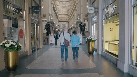 LEIPZIG, GERMANY - MAY 1, 2018. Senior couple walking in the Madler Passage shopping mallのeditorial素材