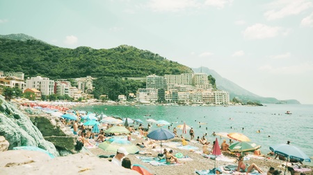 BUDVA, MONTENEGRO - AUGUST 1, 2018. Crowded Becici beach on a summer dayのeditorial素材