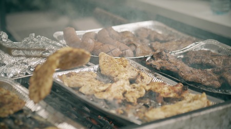 Cooking meat sausages on the BBQ, close-up shot