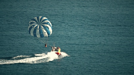BUDVA, MONTENEGRO - JULY 26, 2018. Parasailing parachute and speedboat at seaのeditorial素材