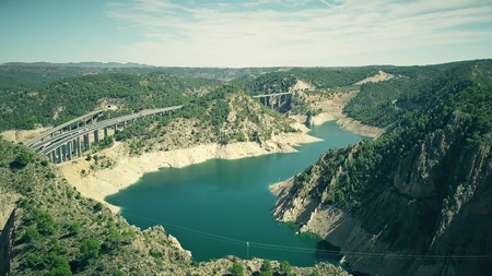 Aerial view of higway and railway bridges in mountainous area of Spainの写真素材