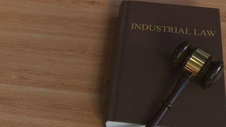 INDUSTRIAL LAW book and court gavel. 3D renderingの写真素材