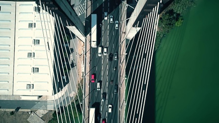 Aerial top-down shot of a cable-stayed car bridge trafficの写真素材