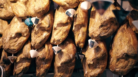 VALENCIA, SPAIN - SEPTEMBER 22, 2018. Jamon legs, famous Spanish specialty, at Mercado Central or Central Marketのeditorial素材