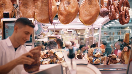 VALENCIA, SPAIN - SEPTEMBER 22, 2018. Jamon and other Spanish meat specialties stall in Mercado Central or Central Marketのeditorial素材