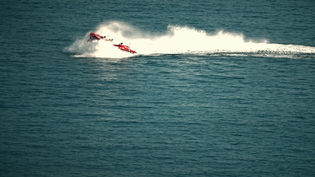 Recreational high speed motorboat makes sudden turn at seaの写真素材