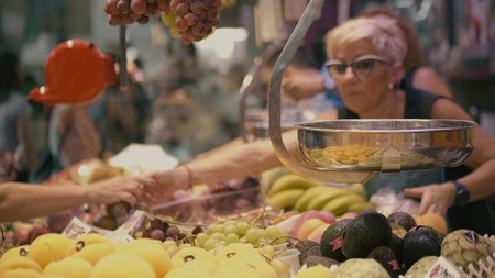 VALENCIA, SPAIN - SEPTEMBER 22, 2018. Customers and vendors at fruit stall in famous Mercado Central or Central Marketのeditorial素材