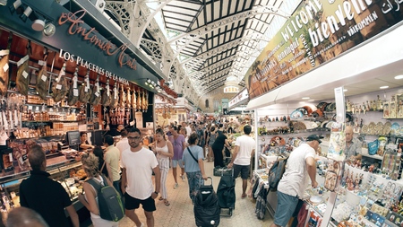 VALENCIA, SPAIN - SEPTEMBER 22, 2018. Food and souvenir stalls in famous Mercado Central or Central Marketのeditorial素材