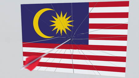 Archery arrow hits flag of MALAYSIA plate. Conceptual 3D renderingの写真素材