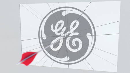 Archery arrow breaks glass plate with GENERAL ELECTRIC company logo. Business issue conceptual editorial 3D renderingのeditorial素材