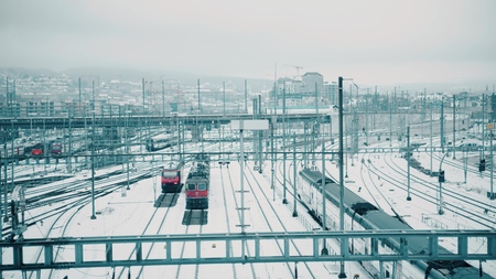 Trains and many railroad tracks in snow in Zurich, Switzerland