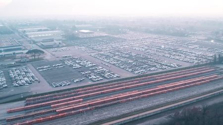 Aerial view of big car factory storage and empty freight trains ready for loadingの写真素材