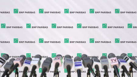 Press conference of BNP PARIBAS, press wall with logo and microphones, conceptual editorial 3D renderingのeditorial素材