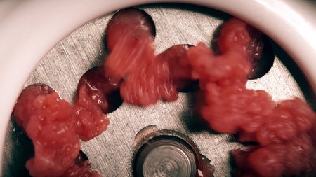 Making raw mincemeat with a mincer, macro shotの写真素材