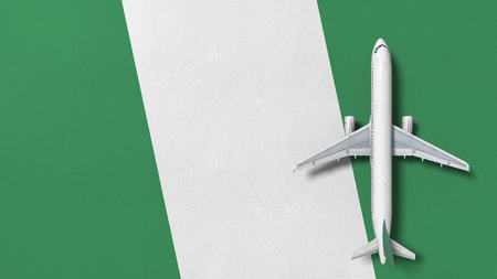 Commercial airplane on the flag of Nigeria. Travel related conceptual 3D renderingの写真素材