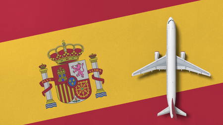 Commercial airplane on the flag of Spain. Travel related conceptual 3D renderingの写真素材