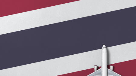 Commercial airplane on the flag of Thailand. Travel related conceptual 3D renderingの写真素材