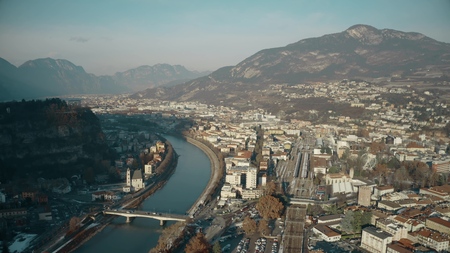 Aerial view of city of Trento, the Adige river and the Alps, Italyの写真素材