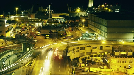 Long exposure night shot of busy industrial seaport area. Genoa, Italyの写真素材