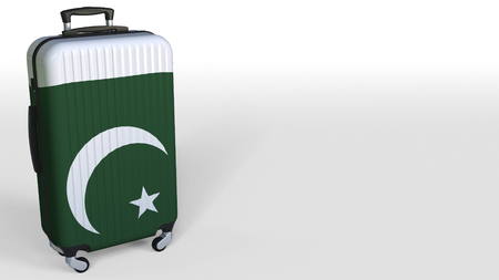 Travelers suitcase with flag of Pakistan. Pakistani tourism conceptual 3D rendering, blank space for captionの写真素材
