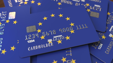 Pile of credit cards with flag of the European Union. EU banking system conceptual 3D renderingの写真素材