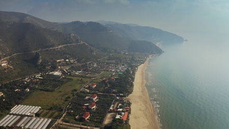 Aerial view of the beach in Sperlonga and surrounding mountains, Italyの写真素材