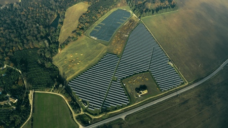 Aerial view of a solar power station and a sheep. Umbria, Italy