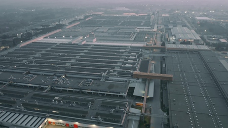Aerial view of a big car factory in the eveningの写真素材
