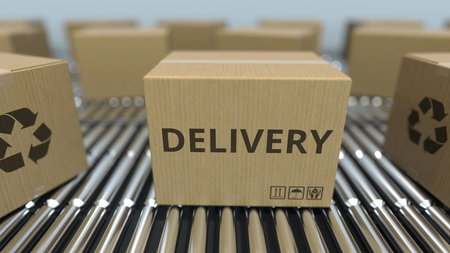 Carton boxes with DELIVERY text move on roller conveyor. 3D renderingの写真素材