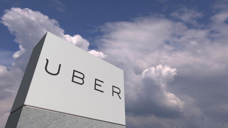 Logo of UBER on a stand against cloudy sky, editorial 3D renderingのeditorial素材