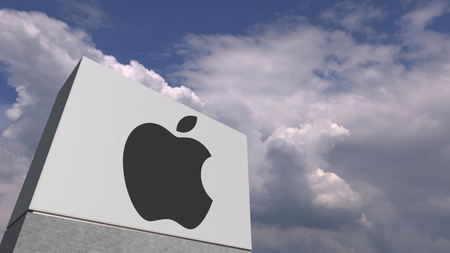 Logo of APPLE INC on a stand against cloudy sky, editorial 3D renderingのeditorial素材