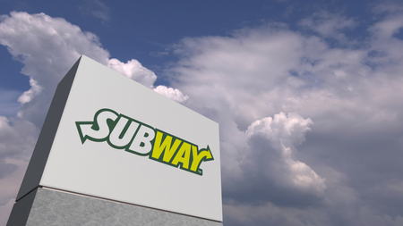 Logo of SUBWAY on a stand against cloudy sky, editorial 3D renderingのeditorial素材