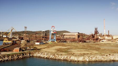 Aerial view of seaport and old industrial area near Piombino, Italyの写真素材