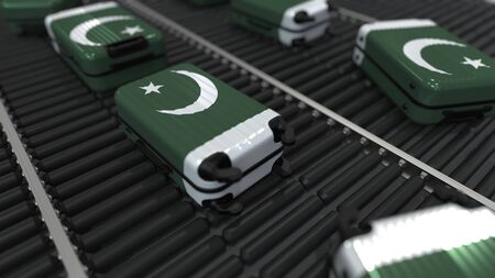 Many travel suitcases featuring flag of Pakistan on roller conveyer. Pakistani tourism conceptual 3D renderingの写真素材