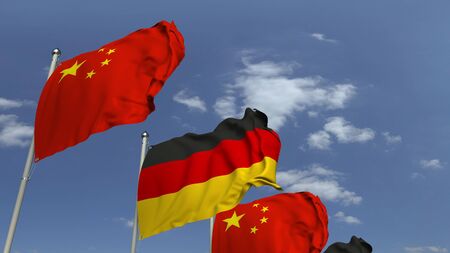 Waving flags of Germany and China on sky background, 3D renderingの写真素材