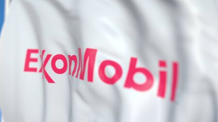Waving flag with Exxon Mobil Corporation logo, close-up. Editorial 3D renderingのeditorial素材