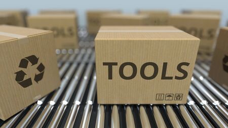Carton boxes with TOOLS text move on roller conveyor. Realistic 3D renderingの写真素材