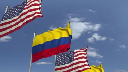 Flags of Colombia and the USA against blue sky, 3D renderingの写真素材