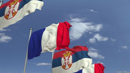 Waving flags of Serbia and France on sky background, 3D renderingの写真素材