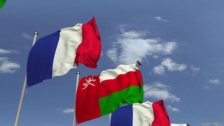 Flags of Oman and France at international meeting, 3D renderingの写真素材