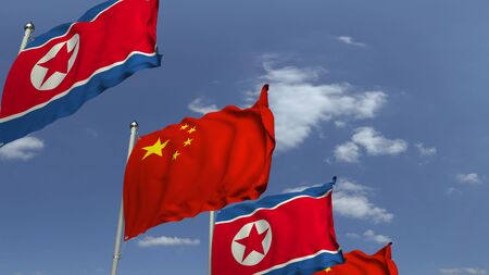 Waving flags of North Korea and China, 3D renderingの写真素材