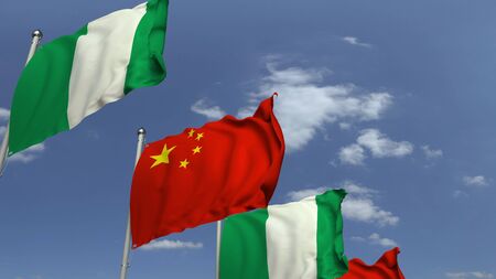 Flags of Nigeria and China against blue sky, 3D renderingの写真素材