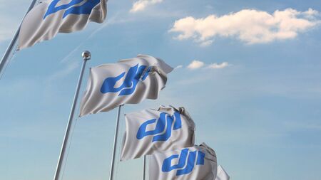 Row of waving flags with DJI logo. Editorial 3D renderingのeditorial素材