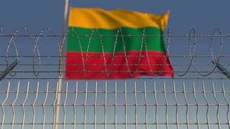 Waving flag of Lithuania behind barbed wire fence. Conceptual 3D renderingの写真素材