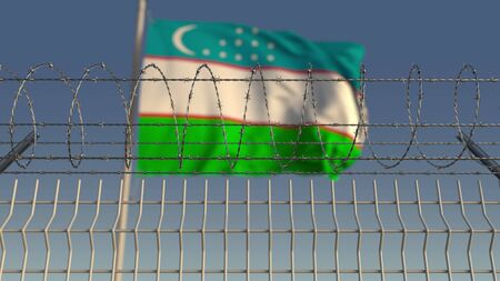 National flag of Uzbekistan behind barbed wire fence. Conceptual 3D renderingの写真素材