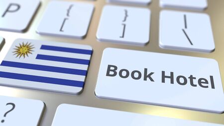 BOOK HOTEL text and flag of Uruguay on the buttons on the computer keyboard. Travel related conceptual 3D renderingの写真素材