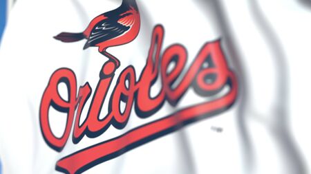 Flying flag with Baltimore Orioles team logo, close-up. Editorial 3D rendering