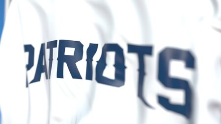 Waving flag with New England Patriots team logo, close-up. Editorial 3D rendering