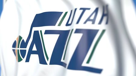 Waving flag with Utah Jazz team logo, close-up. Editorial 3D rendering