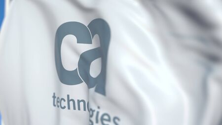 Flying flag with CA Technologies logo, close-up. Editorial 3D rendering